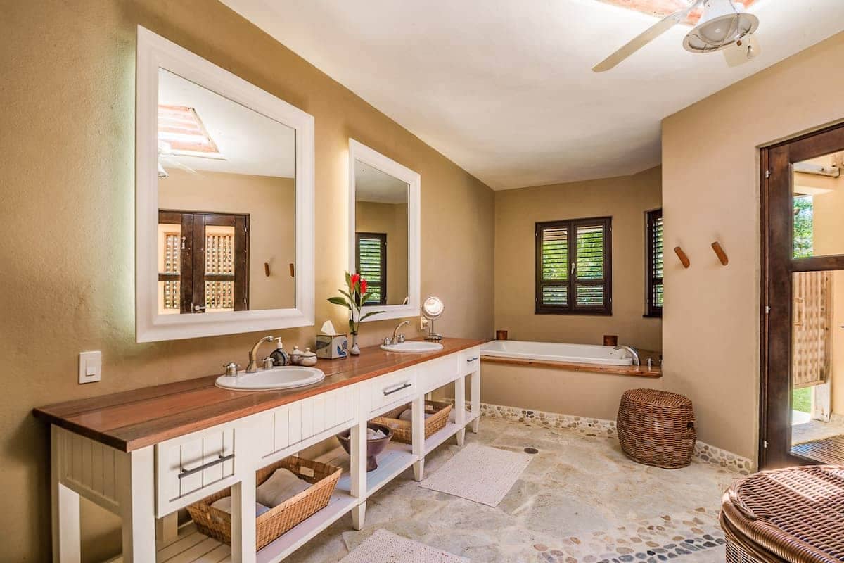 Bathroom with double vanity and bathtub