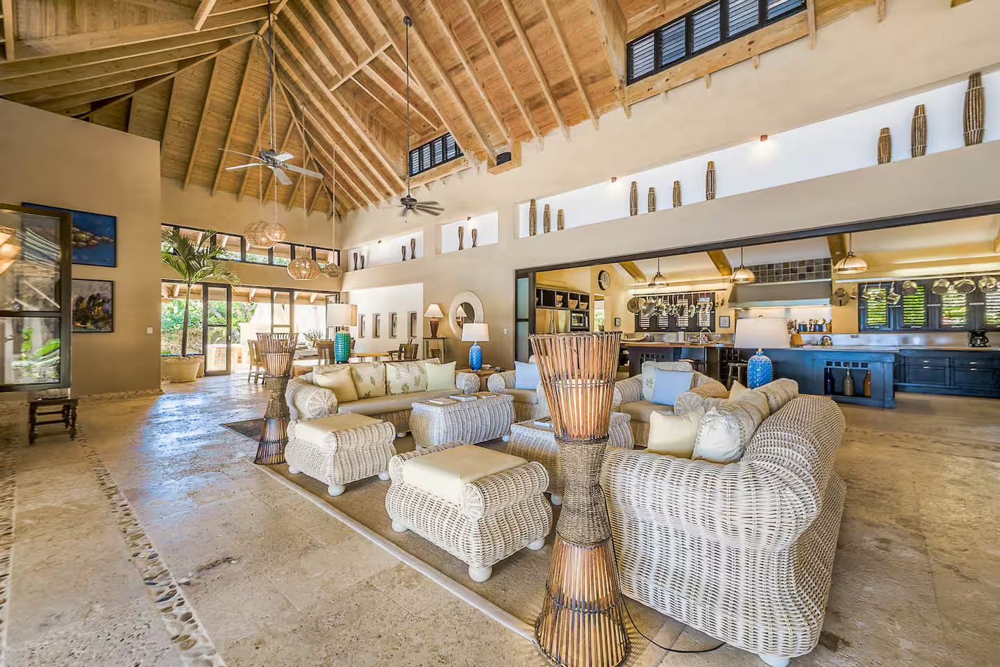 Living room with sofas and the kitchen bar behind