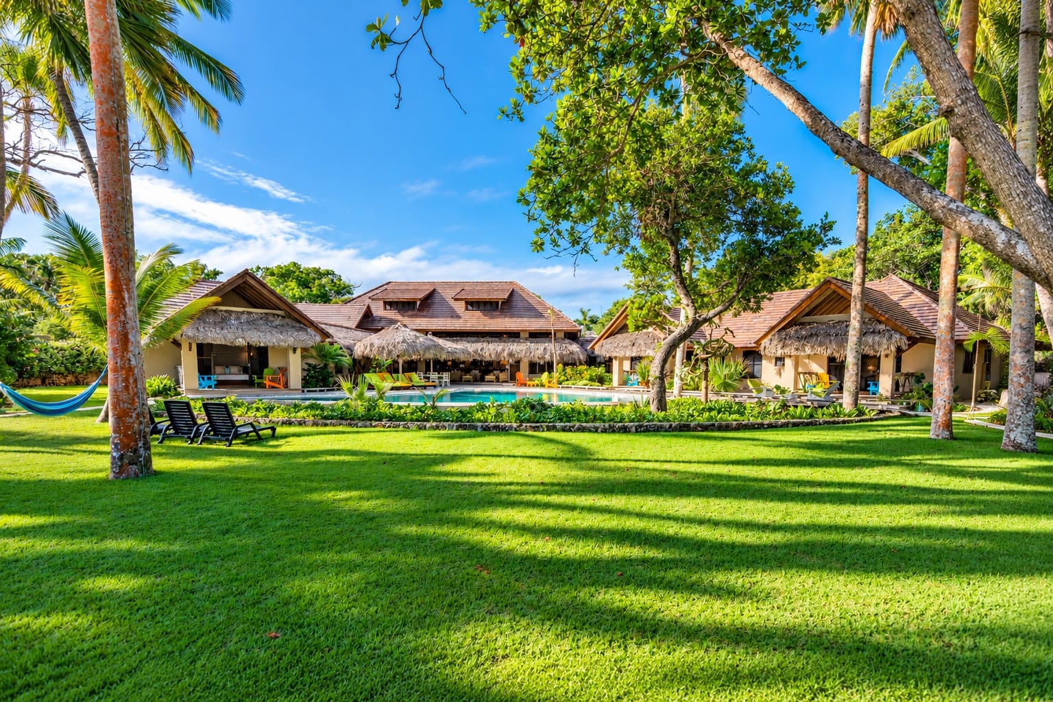 Large tropical lawn in front of the villa