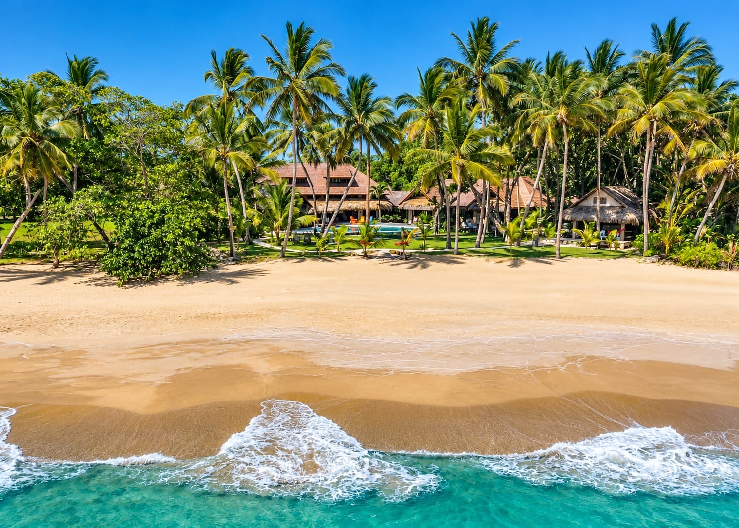 Villa Almara behind the palm trees on its private sandy beach, Sea Horse Ranch, Cabarete