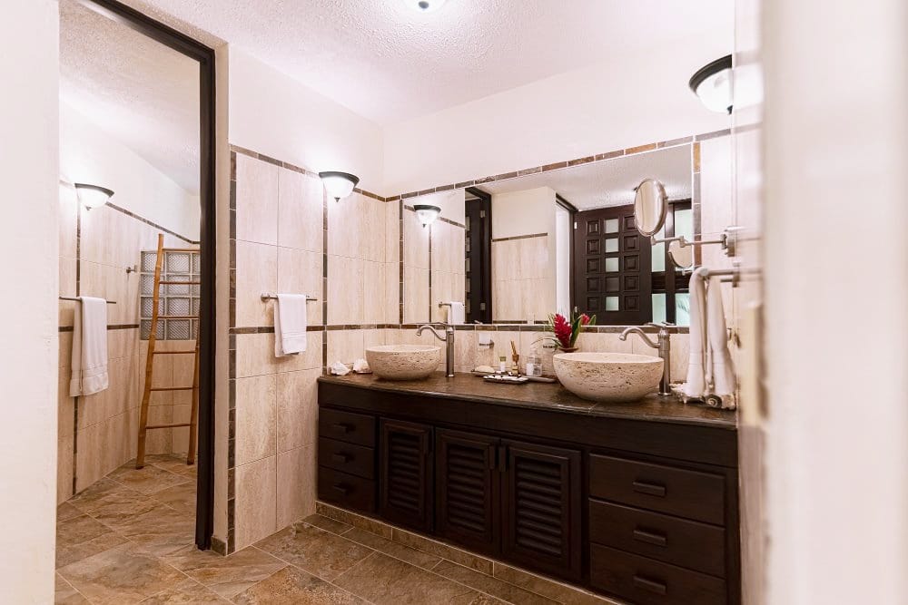 Bathroom with double vanity and walk-in shower