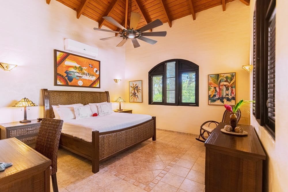 Bedroom with rattan furniture and tropical decor