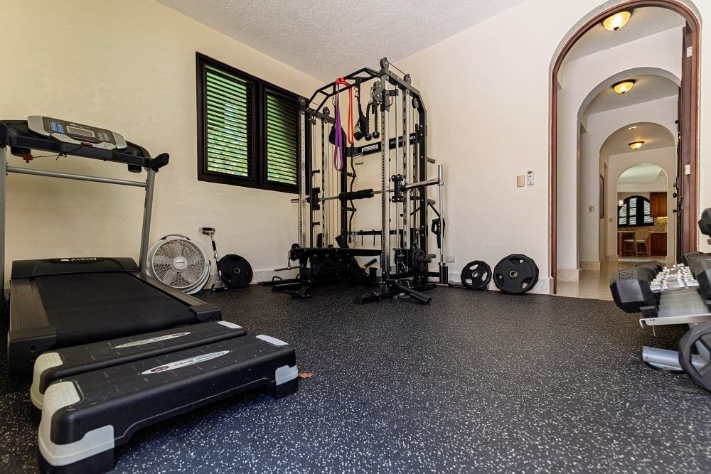 Private gym with treadmill and weights
