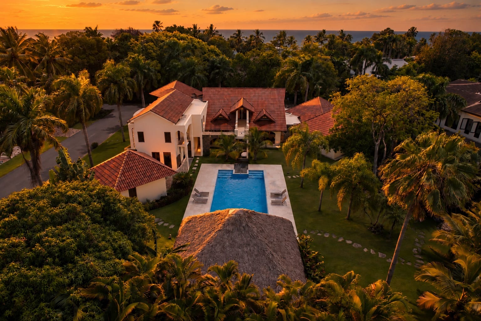 Aerial view of the villa, pool and gazebo at sunset