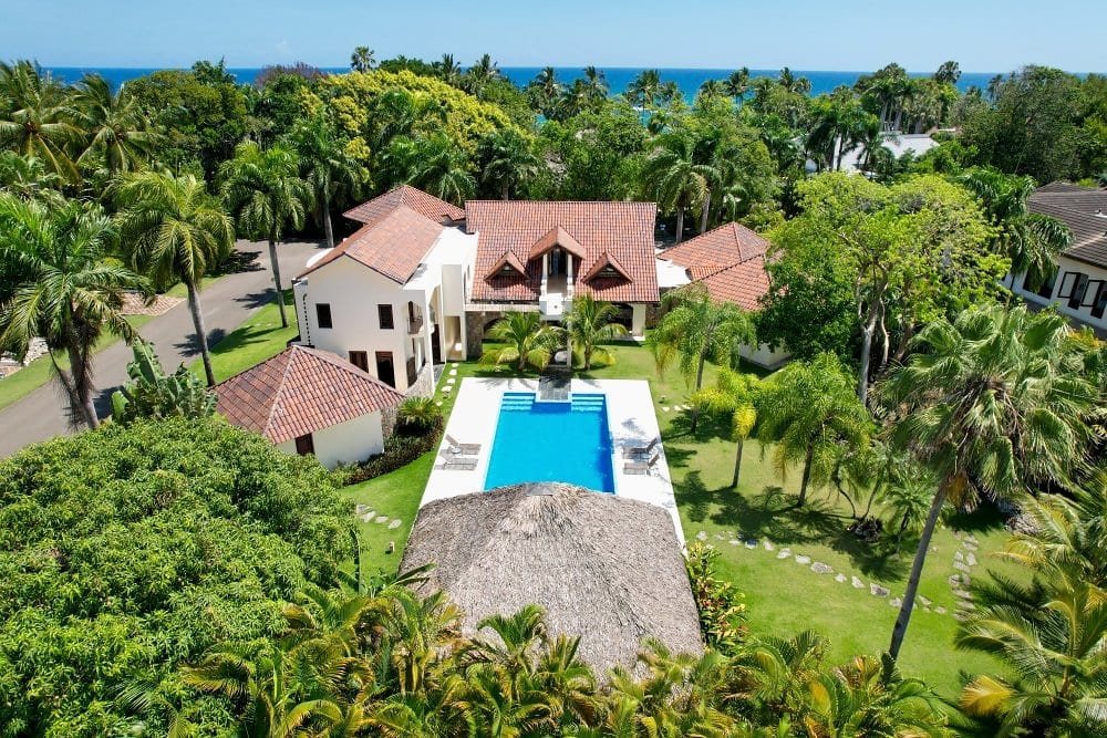 Aerial view of the villa and pool in the tropical gardens