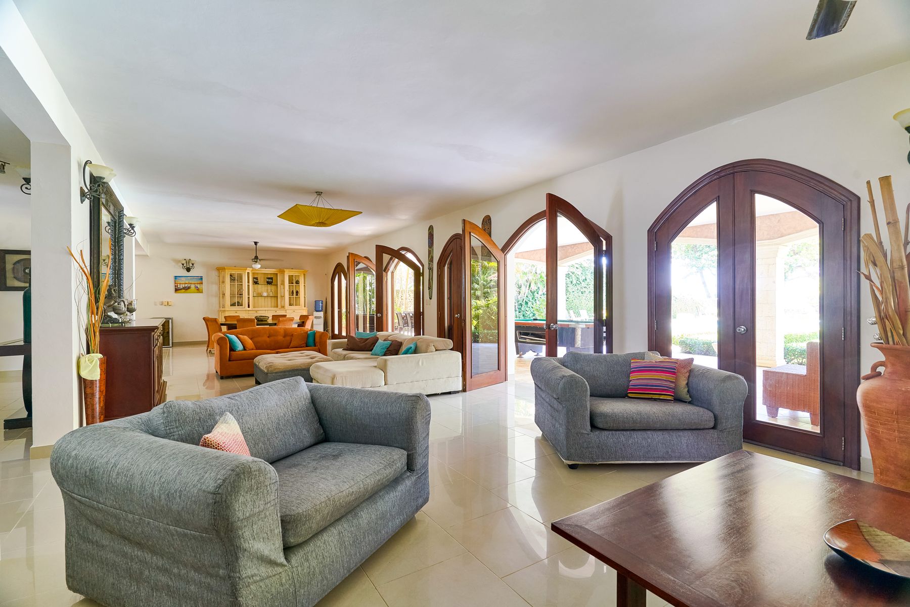Second living room with sofas and garden view