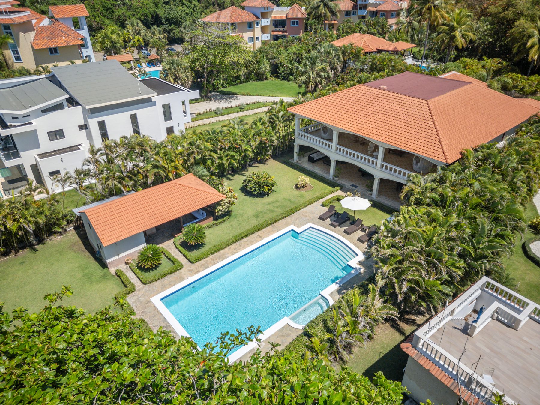 Aerial view of the pool, pool house and tropical gardens