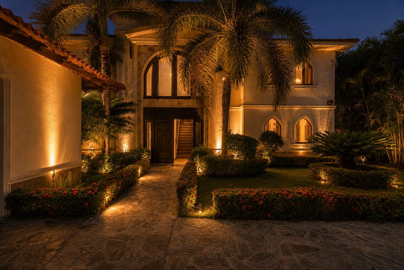 Front entrance of the villa lit at night